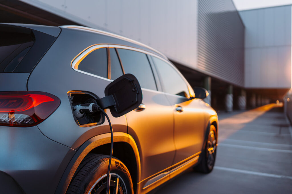 Close-up of electric car charging, ecology transportation conept.