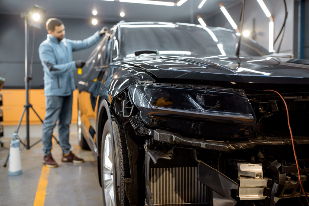 Filming car body at the vehicle service